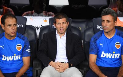New Valencia manager Albert Celades, centre, saw his team thrashed 5-2 by Barcelona in his first game in charge. Getty