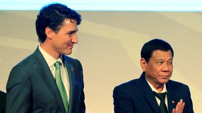 Philippine's president Rodrigo Duterte gestures while walking with Canada's prime minister Justin Trudeau after their family photo during the ASEAN-Canada 40th anniversary commemorative summit in metro Manila, Philippines on November 14, 2017. Romeo Ranoco / Reuters