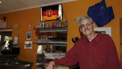 Willi Gau stands at the bar of "The Firm", his controversial Berlin pub.