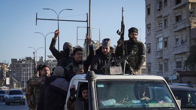 Syrian troops travel through the Sheikh Maqsoud neighbourhood of Aleppo during clashes with Kurdish fighters affiliated with the Syrian Democratic Forces on January 10. Getty Images