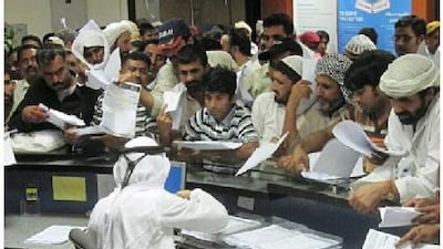 The Daman office in Al Ain is packed with people as thousands rush to avoid fines for failing to have valid health insurance.Essam Al Ghalib / The National