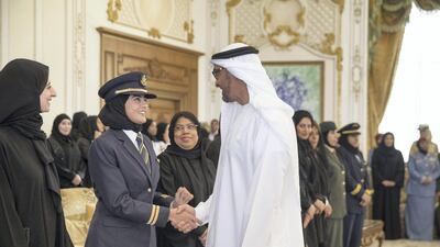 Sheikh Mohammed speaks to an Emirati woman pilot. Sharina Lootah / Crown Prince Court - Abu Dhabi