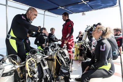 Fernando Reis from Shark Educational Institute and a team of divers head out to Dibba Rock in search of sharks. Antonie Robertson / The National