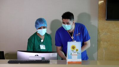 Staff working on an ICU ward treating Covid-19 patients, at the Prime Hospital, in Al Garhoud, Dubai. Pawan Singh / The National