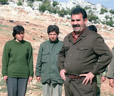 Abdallah Ocalan, right, leader of the PKK, with his guerillas at a training camp in the border village of Helweh, Lebanon. AFP
