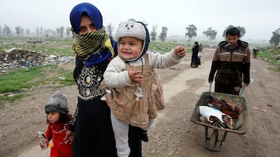 Iraqis in Mosul run for safety after clashes broke out between Iraqi forces battle and ISIL on March 17, 2017. Youssef Boudlal / Reuters