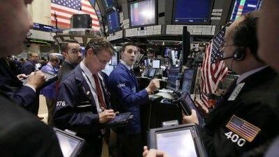 Stocks surged after central banks agreed a coordinated effort to boost liquidity in a bid to prop up the global financial system. Richard Drew / AP Photo