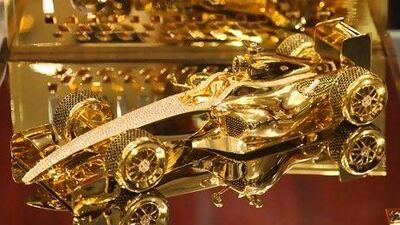 The 22-carat gold-plated, diamond-encrusted miniature F1 car that Style Gallery is selling for Dh175,000. Lee Hoagland / The National