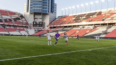 A view of the game in action inside an empty Mohamed bin Zayed Stadium. Chris Whiteoak / The National