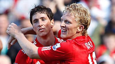 Fernando Torres, left, is congratulated by his Liverpool and teammate Dirk Kuyt after scoring the winner against West Brom.