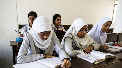 Girls study during a class at the Anglo-Arabic Senior Secondary School in Old Delhi. Front row from left, Namra Alam, Sayed Humera, and Saleha Mazhar. Back row, from left, Alisha Sultana and Sadaf Fatima. Simon de Trey-White