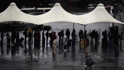 Passengers wait in line at Schiphol Airport, near Amsterdam, July 5, 2023. Strong wind and poor visibility caused by rain forced the KLM Royal Dutch Airlines to cancel 207 flights already. (Photo by Koen van Weel / ANP / AFP) / Netherlands OUT