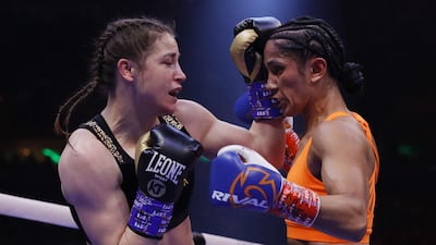 Katie Taylor trades punches with Amanda Serrano. AFP