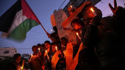 Palestinian children hold candles during a protest against the so-called 'deal of the century' in Gaza. EPA