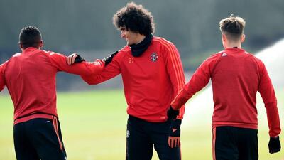 Manchester United’s Belgian midfielder Marouane Fellaini (C) takes part in a team training session at their Carrington Training Centre in Manchester, north west England on March 16, 2016 ahead of their Uefa Europa League second leg football match against Liverpool. AFP / Paul ELLIS