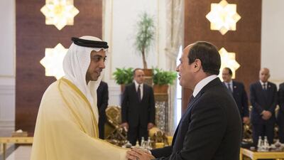 Sheikh Mansour bin Zayed, Deputy Prime Minister and Minister of Presidential Affairs, greets Abdel Fattah El Sisi, President of Egypt, during a reception at the Presidential Airport. Ryan Carter / Crown Prince Court - Abu Dhabi