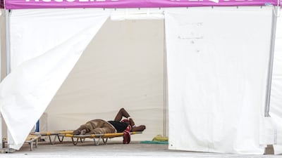 A rescued passenger lies in a medical tent in Boulogne. AFP