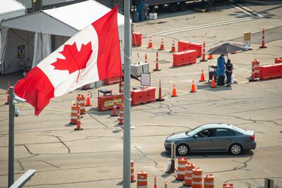 Car crosses the border into Canada in Niagara Falls, Ontario. The Canadian Press via AP