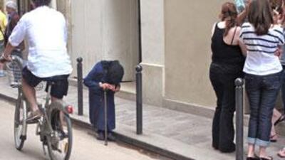 At regular intervals, the old woman would empty almost all the contents of the cup into a deep coat pocket.