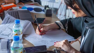 One of the 49 Emirati artists sketches an idea for a logo. Courtesy Ministry of Cabinet Affairs and The Future