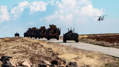 A joint Russian-Turkish patrol advances in the countryside of the Syrian town of Al Jawadiyah, in the northeastern Hasakeh province. AFP