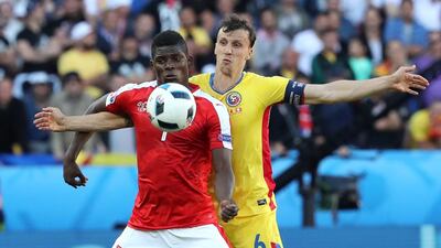 Breel Embolo (L) of Switzerland in action against Vlad Chiriches of Romania during the UEFA EURO 2016 group A preliminary round match between Romania and Switzerland at Parc de Princes in Paris, France, 15 June 2016. EPA/ABEDIN TAHERKENAREH