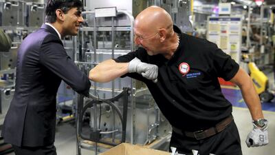 An employee at the Worcester Bosch factory can't resist an elbow bump with Mr. Sunak. Getty Images
