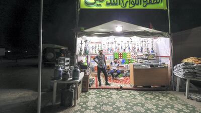 One of two tobacco shops on Millions Street at the Al Dhafra Festival. Abu Dhabi, United Arab Emirates, December 10, 2019. Victor Besa / The National