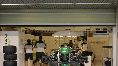 The Caterham F1 team shown working at Yas Marina Circuit during the Abu Dhabi Grand Prix. Caren Firouz / Reuters / November 20, 2014