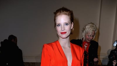Jessica Chastain, in a red dress, attends the Saint Laurent autumn/winter 2013 show on March 4, 2013 in Paris. Getty Images