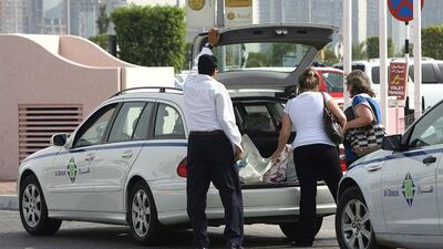 Shoppers loading up a limousine at Marina Mall in Abu Dhabi yesterday.