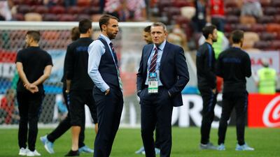 England manager Gareth Southgate with England U21 manager Aidy Boothroyd on the pitch before the match. Reuters
