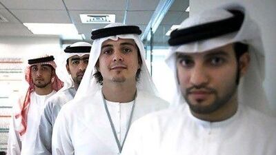 From left, Hamad al Hamadi, Nayef Qassim Shahin, Omar Kazim and Mohamed al Kaabi form a team of UAE nationals that work at Yahsat's mission control station. Lee Hoagland / The National