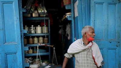 A dry food vendor waits for customers at his street food shop in Kolkata, Eastern India, October 9. Piyal Adhikary / EPA