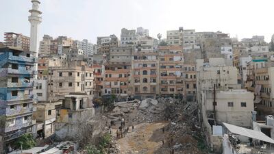 Rescue teams search for survivors after a building collapsed in Tripoli, Lebanon. EPA