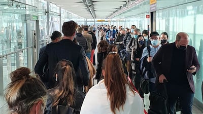 Passengers queue in the arrival hall at Heathrow Airport's Terminal 5 after a previous e-gates problem in October. PA