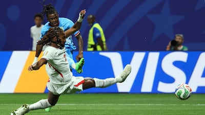 Congo forward Brian Cipenga scores his team's early goal despite the attentions of England defender Djed Spence. AFP