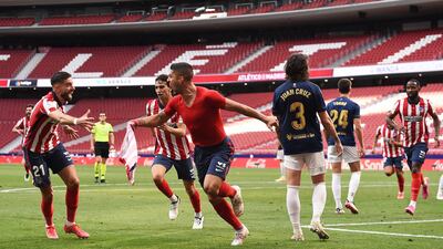 Luis Suarez celebrates with teammates after scoring the second goal against Osasuna. Getty Images