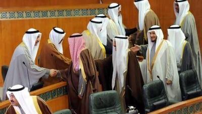 Kuwaiti Ministers (right) welcome new Members of Parliament at the opening of the parliament in Kuwait city.