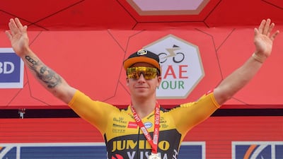 Jumbo Visma rider Dylan Groenewegen celebrates on the podium after winning Stage 4 of the UAE Tour. AFP
