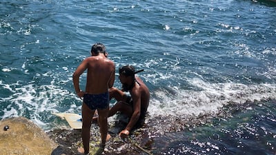 Children playing on Beirut's shoreline. Jamie Prentis / The National
