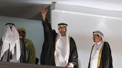Sheikh Mohammed bin Zayed, Crown Prince of Abu Dhabi and Deputy Supreme Commander of the Armed Forces (C), and Sheikh Humaid bin Rashid, Ruler of Ajman (R), attend 44th UAE National Day celebrations at Zayed Sports City. Philip Cheung / Crown Prince Court - Abu Dhabi
