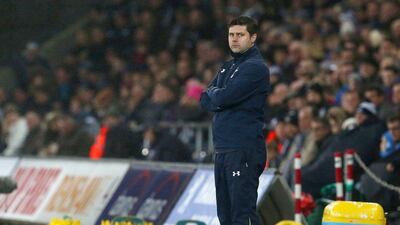 Tottenham Hotspur manager Mauricio Pochettino observes his side during their Premier League win against Swansea City on Sunday, Geoff Caddick / AFP / December 14, 2014