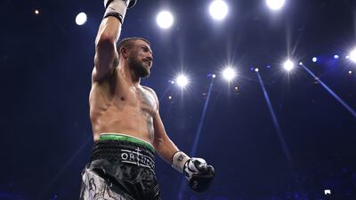 Lomachenko celebrates his win. EPA