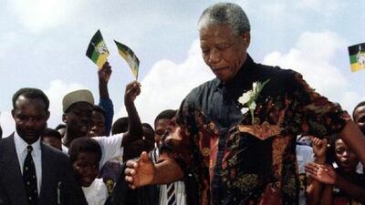 Mandela demonstrates his football skills at an ANC rally in the western Transvaal province in January 1994. Patrick de Noirmont / Reuters