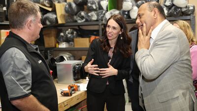 Prime Minister Jacinda Ardern (C), MP Willie Jackson (R) meets with Alister Baird from New Zealand Homes Solutions (L) who employed apprentice Jake Alder under the Mana in Mahi scheme in Tauranga, New Zealand. Getty Images