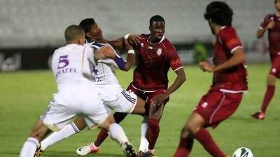 Papa Waigo, centre, the Al Wahda forward, was all too often squeezed out by a stubborn Al Ain defence last night. Pawan Singh / The National