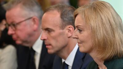 New Foreign Secretary Liz Truss, right, sits next to Deputy Prime Minister Dominic Raab, centre, at the Cabinet meeting. AFP