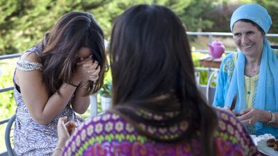 20:20 - Sa'da's friend Carima, 30, and Carima's mother, Farida Mamerie, relax as they prepare the dates and tomatoes for the iftar.