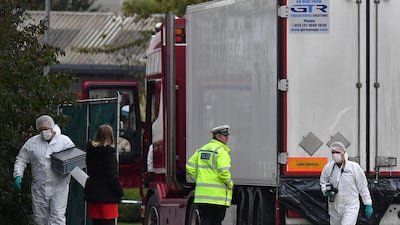 British Police forensics officers work on the lorry found containing 39 dead bodies in October. AFP